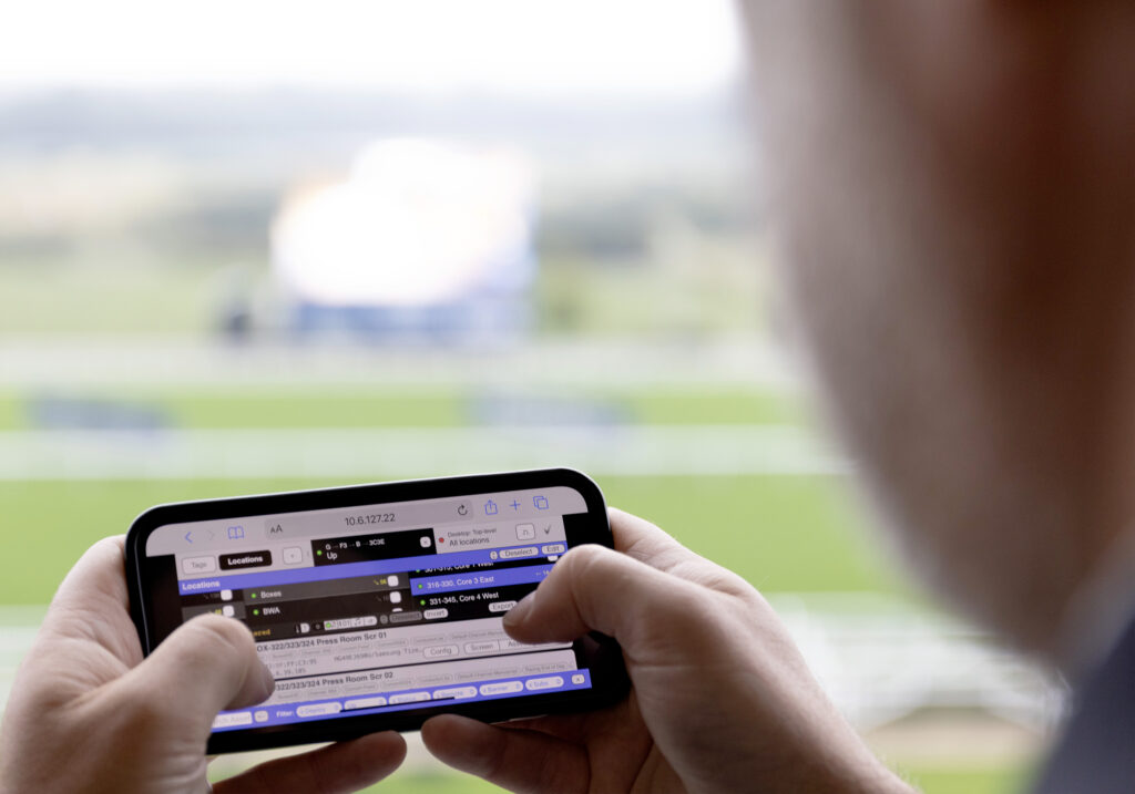 StreamVue digital signage platform being controlled in real time from a mobile device at Ascot Racecourse